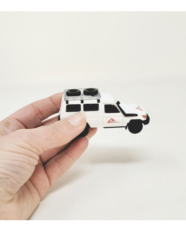 Cochecito de juguete miniatura Médicos sin Fronteras